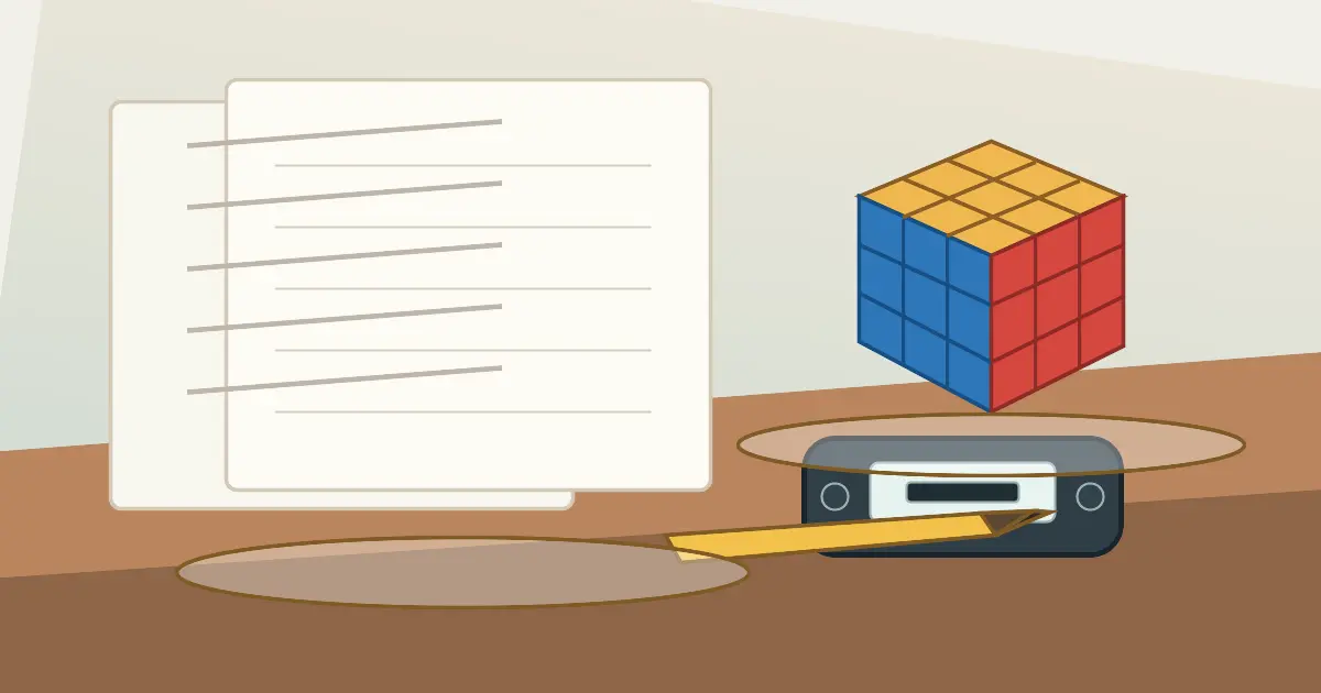 A Fewest Moves competition desk with a 3x3 cube, pencil, timer, and solution sheets.